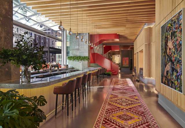 Everdene at Virgin Hotels New York, featuring an large windows and stylish interiors.